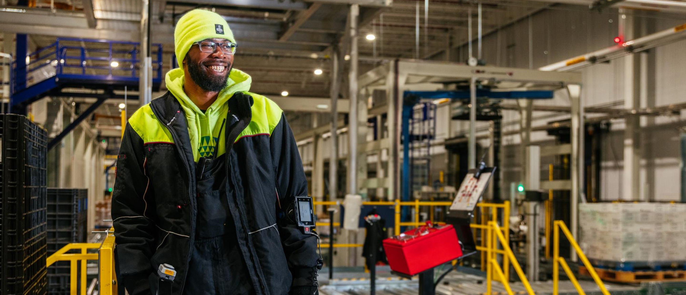 A Lineage employee in a cold storage warehouse