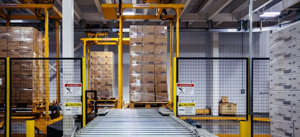 Automated cold storage pallet handling system using advanced computer vision technology for efficient material processing.